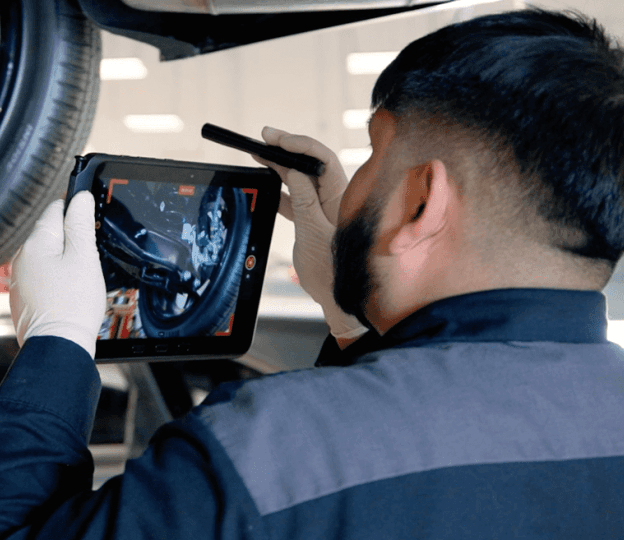 man doing a car inspection